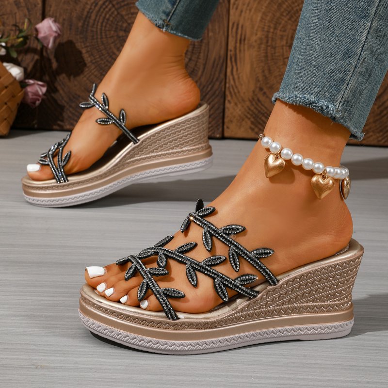 A woven raffia-style women's wedge sandal shown at an angle showing the wedge and upper texture